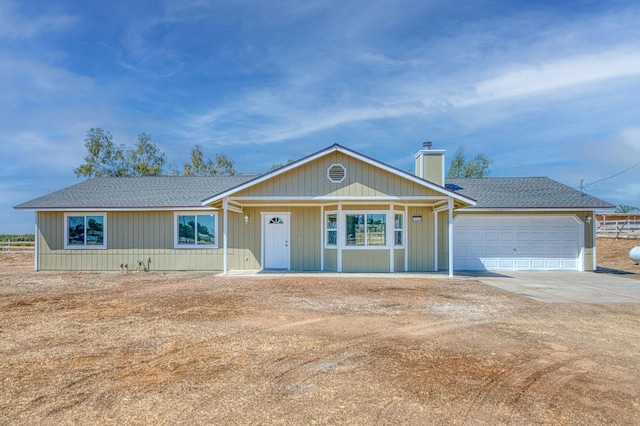 ranch-style home featuring a garage