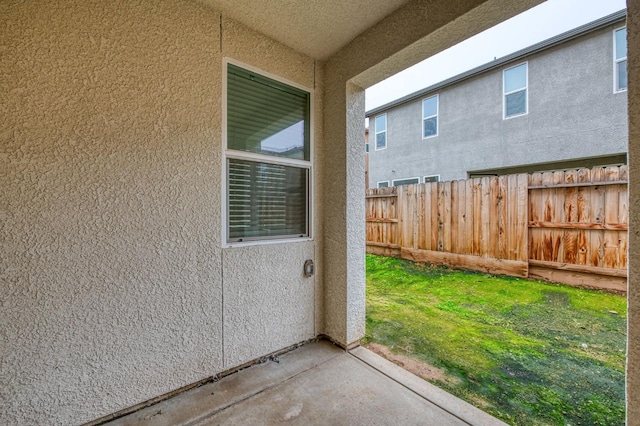 view of exterior entry featuring a yard