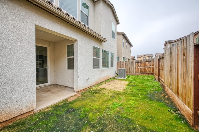 view of yard with central AC