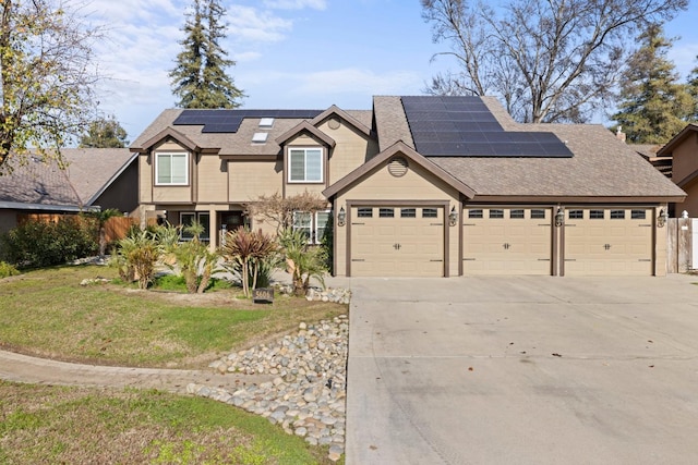 view of front facade featuring solar panels, a garage, and a front lawn