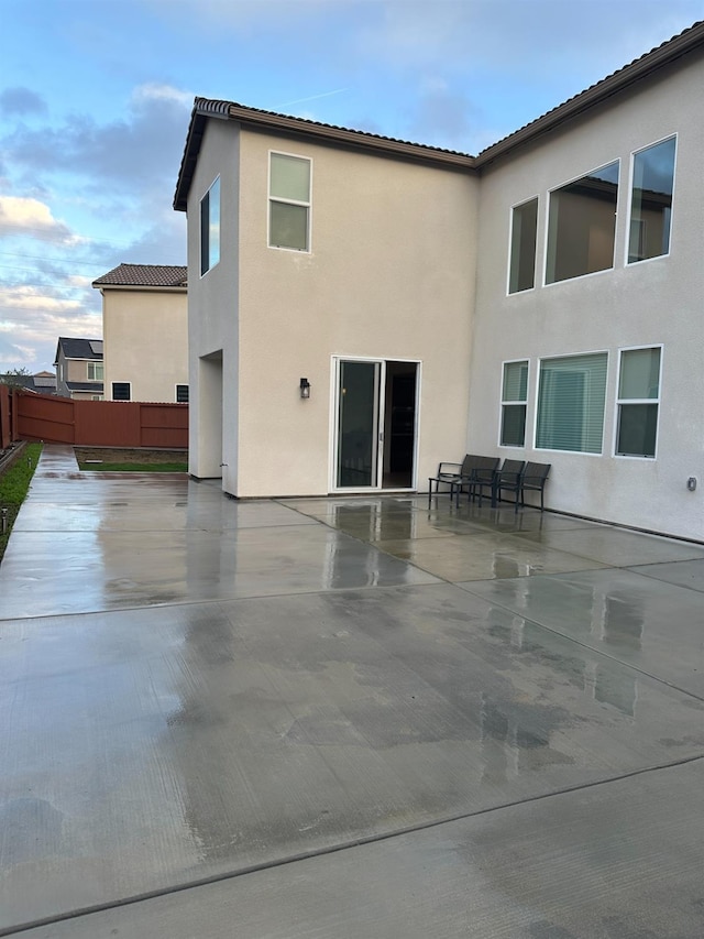 back of house with a patio