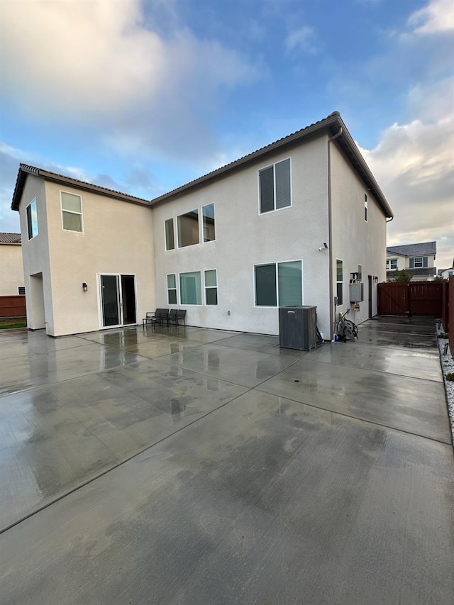 rear view of house with cooling unit