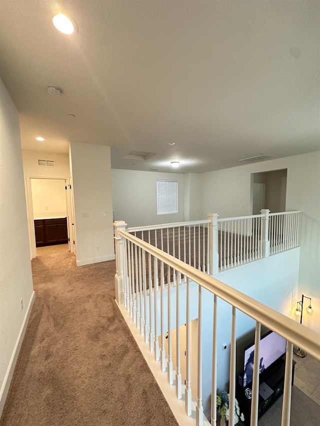 corridor featuring carpet floors