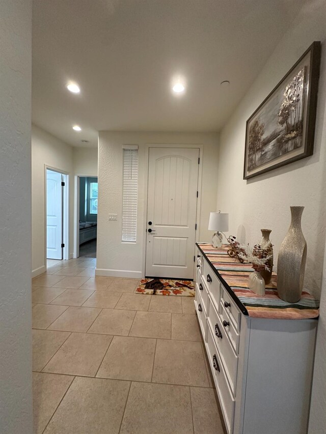 entrance foyer with light tile patterned floors