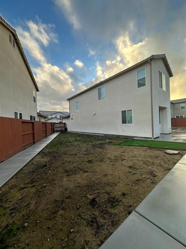 view of property exterior at dusk