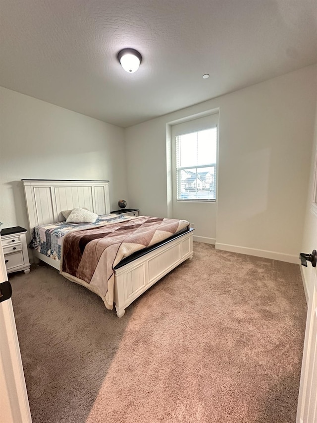 bedroom featuring carpet