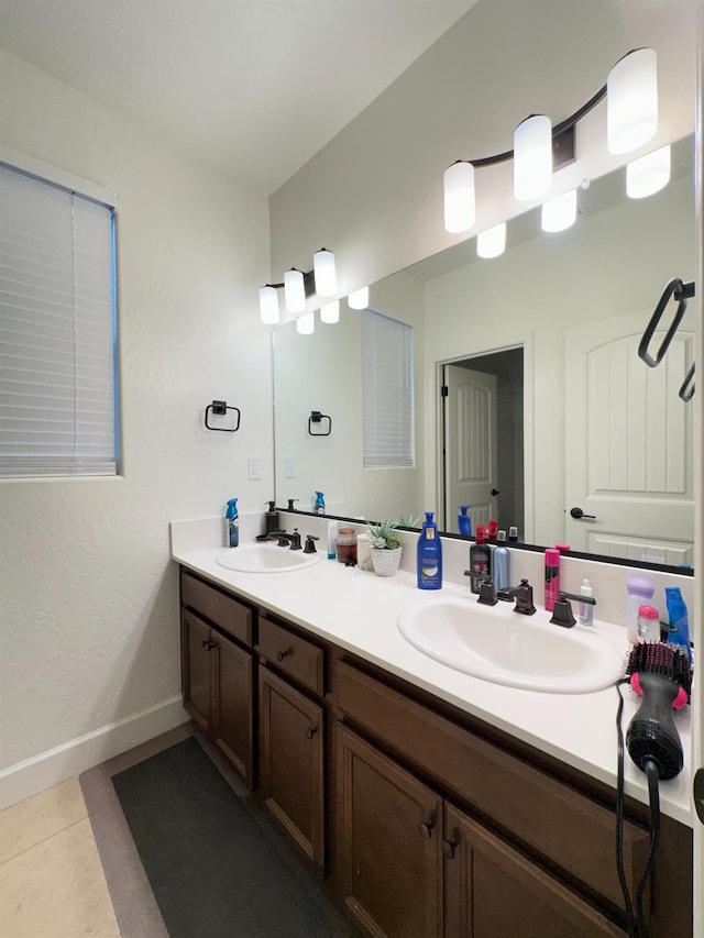 bathroom with tile patterned flooring and vanity