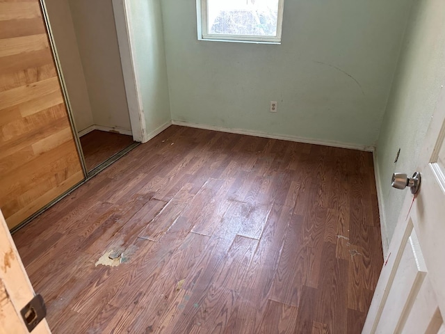 spare room with hardwood / wood-style flooring