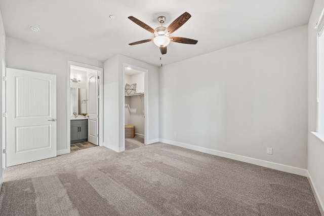 946 Talus Way S, Madera, CA 93636 - unfurnished bedroom with carpet floors, a walk in closet, connected bathroom, a closet, and ceiling fan