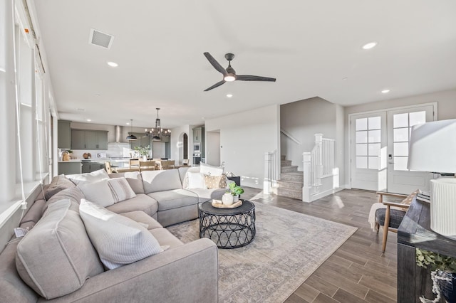 946 Talus Way S, Madera, CA 93636 - living area with stairway, ceiling fan, a chandelier, recessed lighting, and dark wood-style flooring