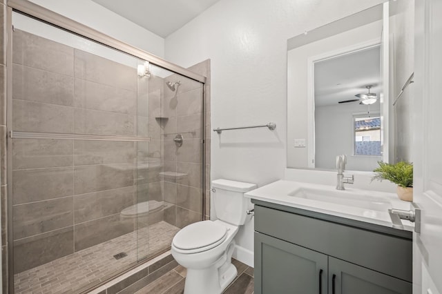 946 Talus Way S, Madera, CA 93636 - bathroom with vanity, a shower stall, wood finished floors, and a ceiling fan