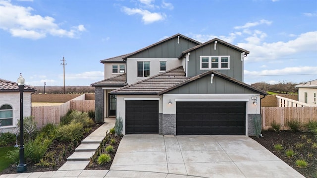 946 Talus Way S, Madera, CA 93636 - view of front of property featuring board and batten siding, driveway, a tiled roof, a garage, and an attached garage
