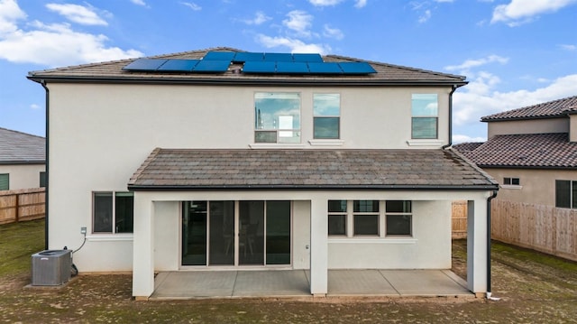 946 Talus Way S, Madera, CA 93636 - rear view of property with stucco siding, a patio, a fenced backyard, and roof mounted solar panels