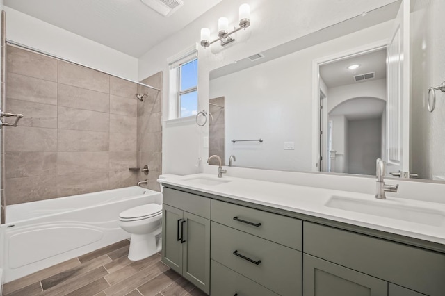 946 Talus Way S, Madera, CA 93636 - bathroom with double vanity, shower / bath combination, and wood finished floors
