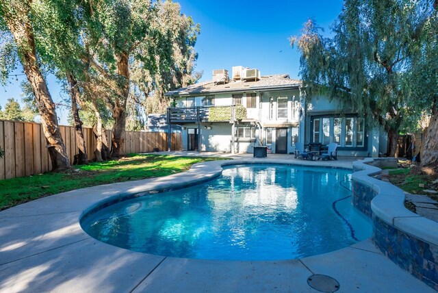 view of swimming pool with a patio area