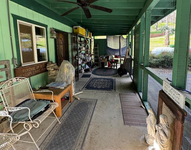 sunroom / solarium featuring ceiling fan