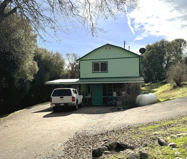 view of front of home with a carport