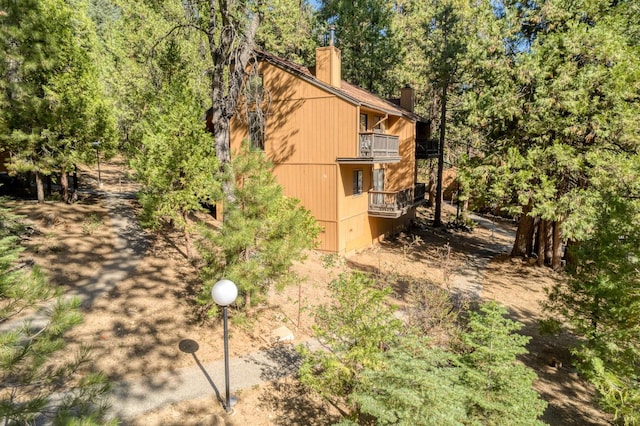 view of home's exterior featuring a balcony