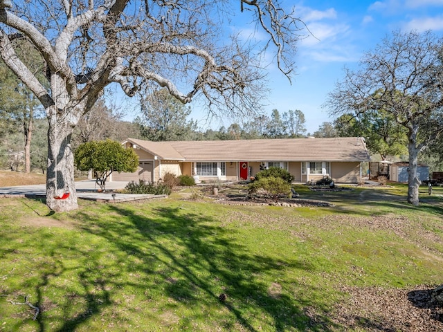28899 Limestone Way, Coarsegold, CA 93614 - single story home with a storage unit, a front yard, an outdoor structure, and driveway