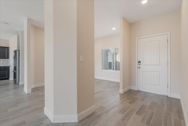 foyer with light hardwood / wood-style floors