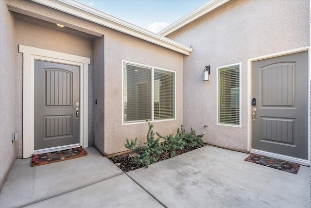 doorway to property featuring a patio