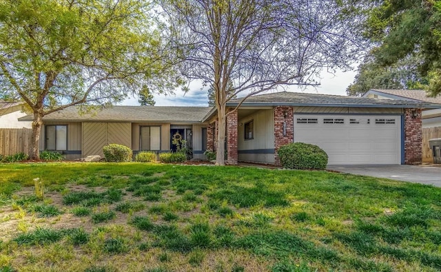 ranch-style home featuring a front yard and a garage