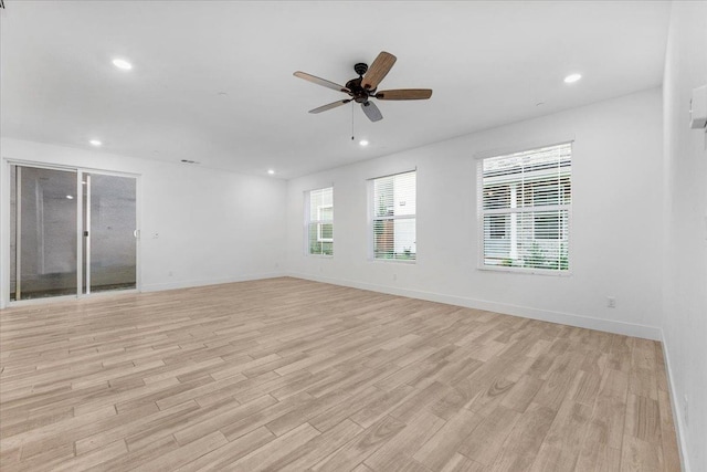 unfurnished room featuring ceiling fan and light hardwood / wood-style flooring