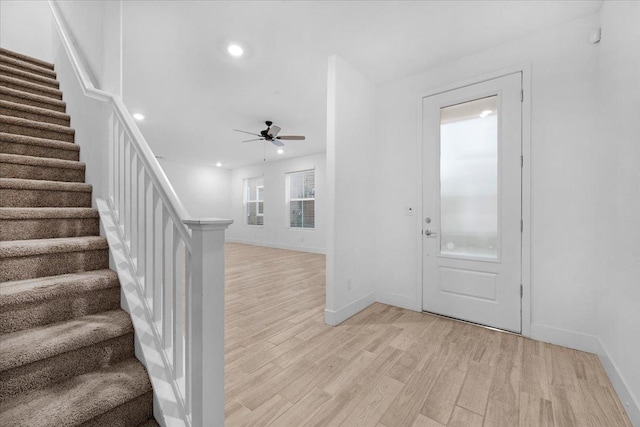 entryway with ceiling fan and light hardwood / wood-style floors