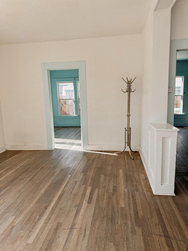 unfurnished room featuring dark hardwood / wood-style floors