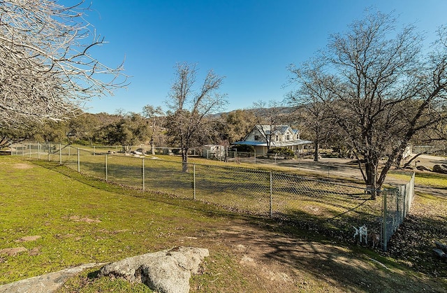 view of yard with a rural view