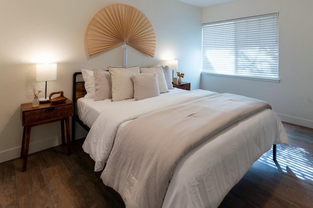 bedroom featuring dark hardwood / wood-style flooring