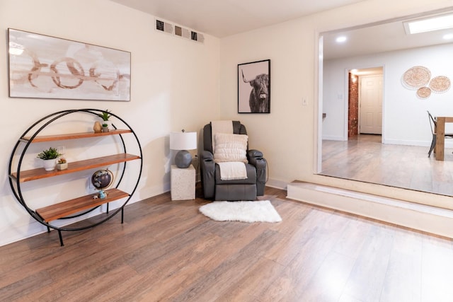 sitting room featuring hardwood / wood-style floors