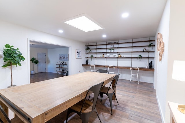 dining space with dark wood-type flooring