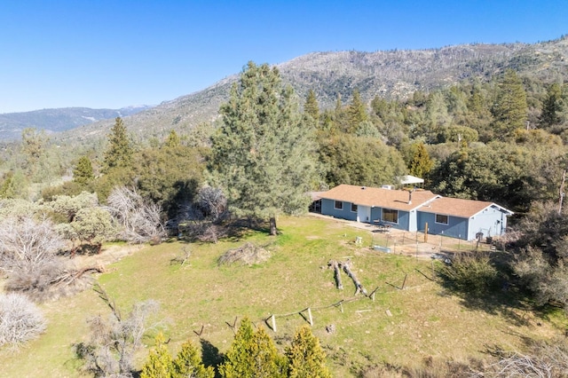 bird's eye view with a mountain view and a wooded view