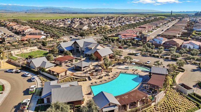 birds eye view of property featuring a mountain view