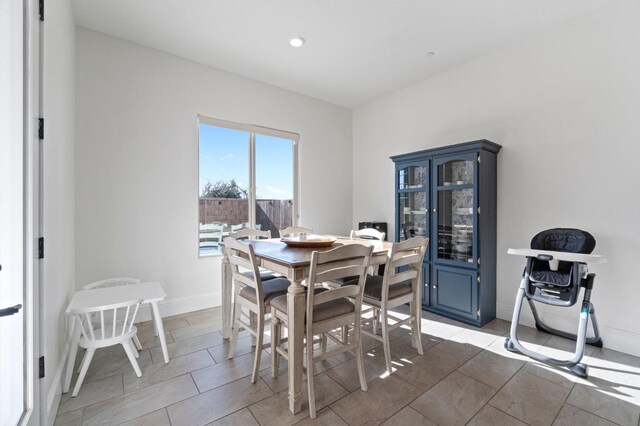 dining area with tile patterned flooring