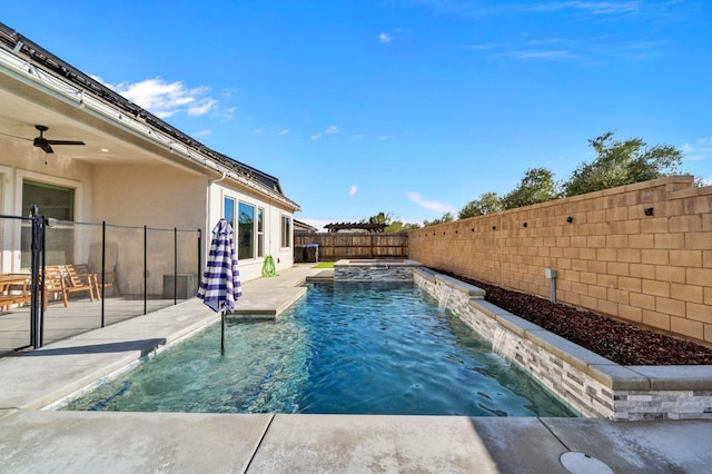 view of pool featuring a patio area, ceiling fan, and pool water feature