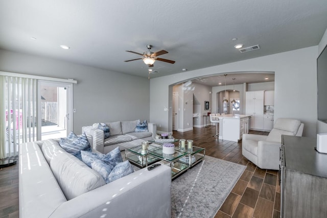 living room featuring ceiling fan