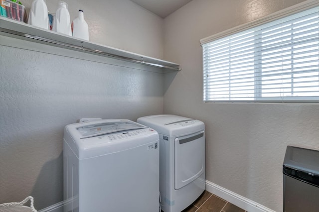 laundry area with washing machine and clothes dryer