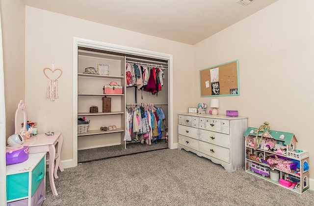 bedroom featuring light colored carpet and a closet