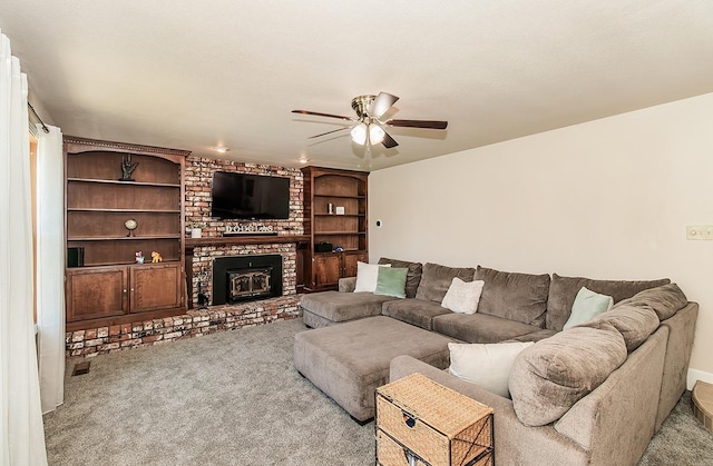 living room featuring light carpet, ceiling fan, and a wood stove