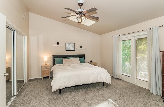 carpeted bedroom featuring lofted ceiling and ceiling fan