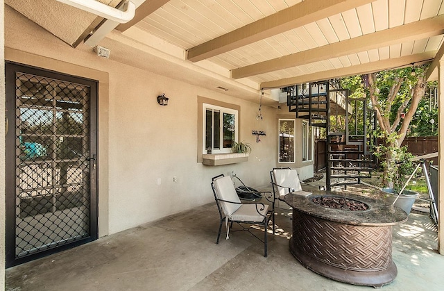 view of patio / terrace with an outdoor fire pit