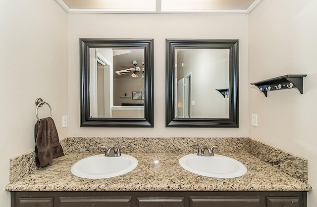 bathroom featuring ceiling fan and vanity