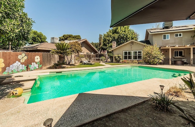 view of swimming pool featuring a patio