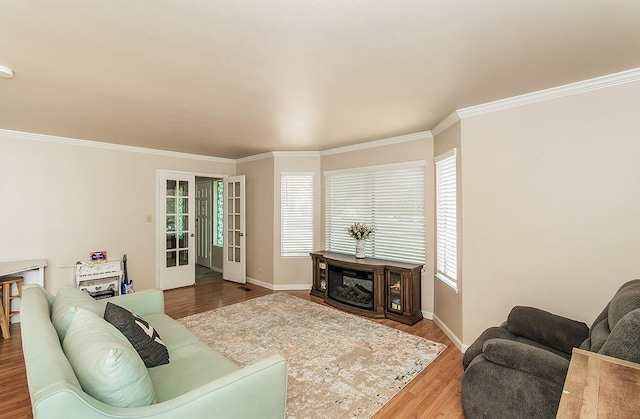 living room featuring ornamental molding, french doors, and hardwood / wood-style flooring