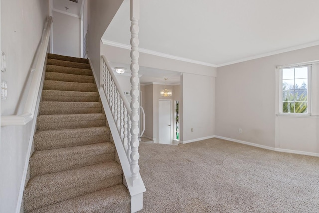 stairway with carpet floors, ornamental molding, and a chandelier