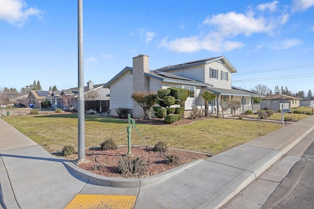 view of front of property featuring a front yard