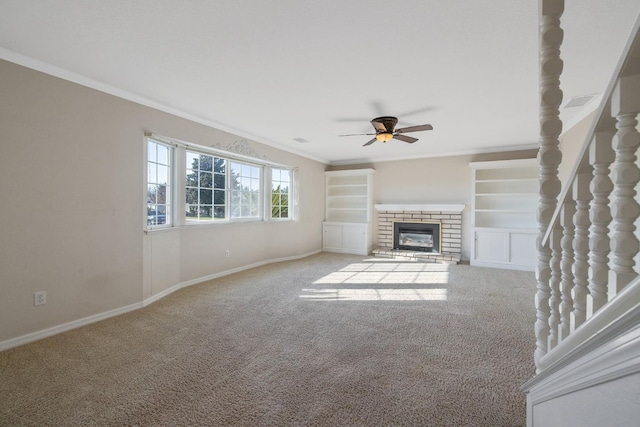 unfurnished living room featuring a brick fireplace, ceiling fan, ornamental molding, and light carpet