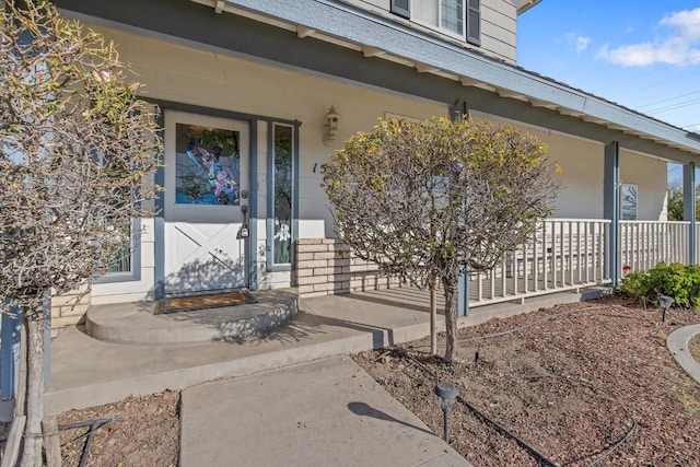 doorway to property with a porch